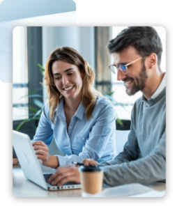 A man and a woman looking at the laptop with smiling faces